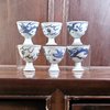 AA59 Six blue and white porcelain stem cups, circa 1643, each painted with a dragon chasing a flaming pearl.circa 1643