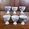 AA59 Six blue and white porcelain stem cups, circa 1643, each painted with a dragon chasing a flaming pearl.circa 1643