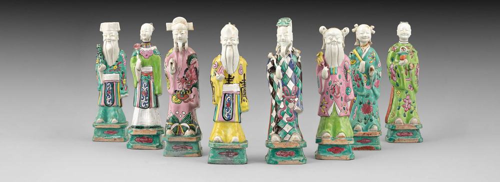 AA86 Eight Chinese famille rose Daoist immortals, Qing dynasty, circa 1780 each figure holding its attribute, 24cm high