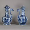 W750 Pair of Chinese blue and white ‘phoenix-head’ ewers and covers, Kangxi (1662-1722), of octagonal ogee-shaped section with ribbed necks, flaring rims and ornate phoenix-form spouts; the bulbous bodies