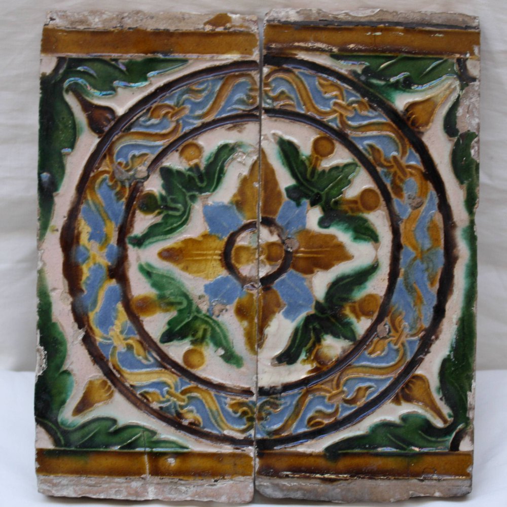 N720 Two polychrome Spanish pottery ceiling tiles, c1500-50