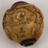 N750 Carved ivory ojime bead; signed Tozan, Meiji