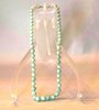 N922 Jade necklace of graduating beads, length: 19in., 48.4cm.