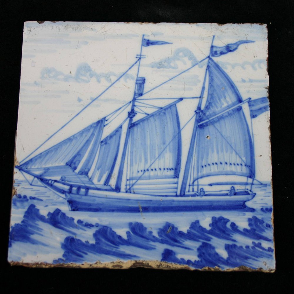 P18 Blue and white tile with a shipping scene