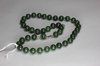 P217 Dark green jade bead necklace, length: 18 3/4in., 47.5cm. 