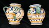 P475 A pair of Italian maiolica polychrome single-handled drug jars