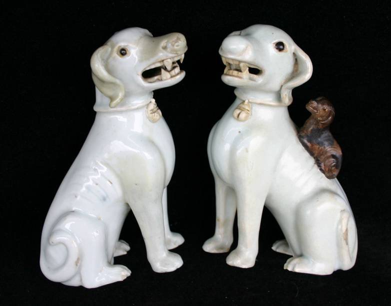 Q282 Pr of Chinese white porcelain models of a seated dog and a bitch