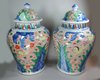 Q858 Pair of Chinese Wucai baluster vases and covers