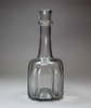 R986 An English cruciform-shape glass decanter, mould blown