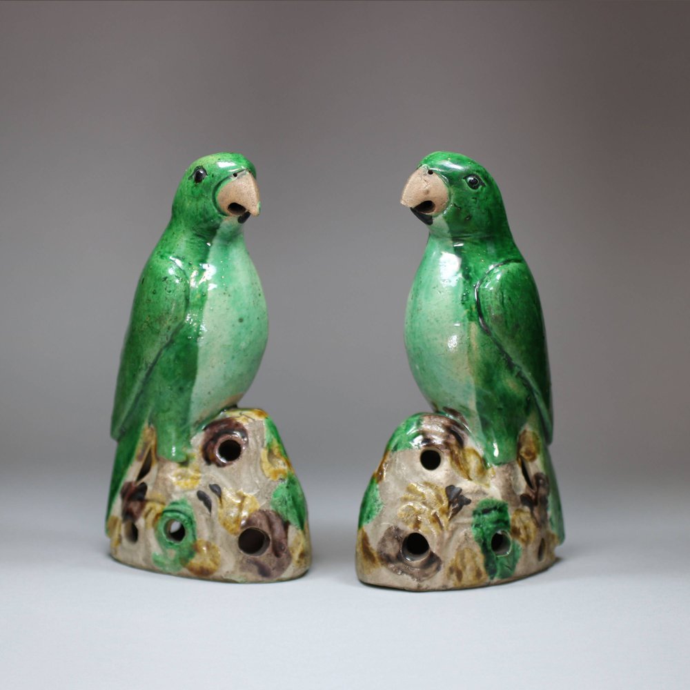 U342 Pair of famille verte biscuit parrots, Kangxi (1662-1722)