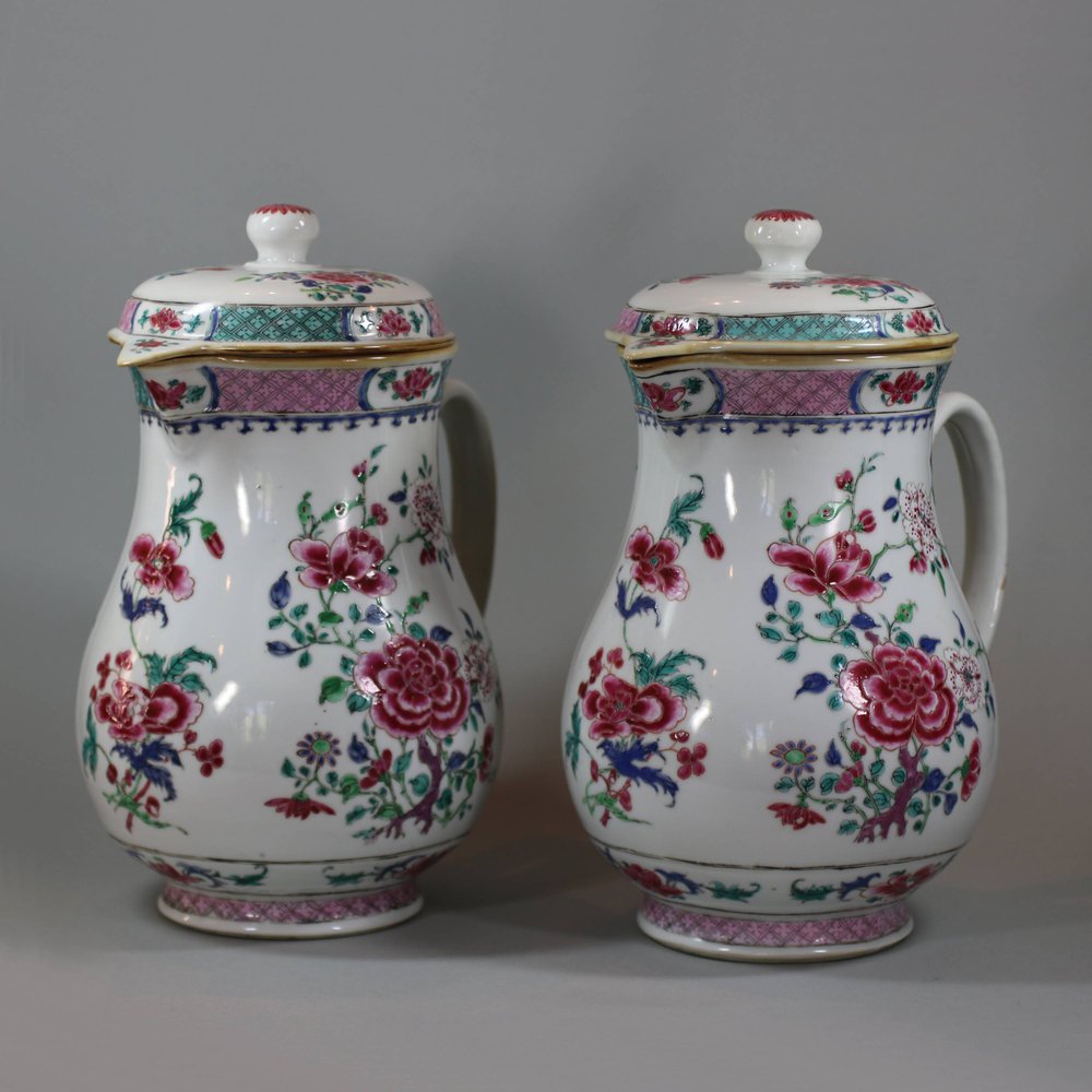 U768 Pair of large famille rose jugs and covers