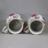 U768 Pair of large famille rose jugs and covers