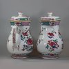 U768 Pair of large famille rose jugs and covers