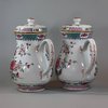 U768 Pair of large famille rose jugs and covers