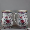 U768 Pair of large famille rose jugs and covers