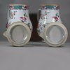 U768 Pair of large famille rose jugs and covers