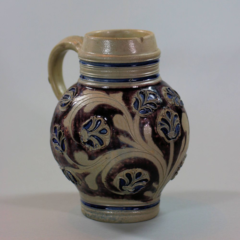 U828 Small German Westerwald salt-glazed tankard, circa 1700