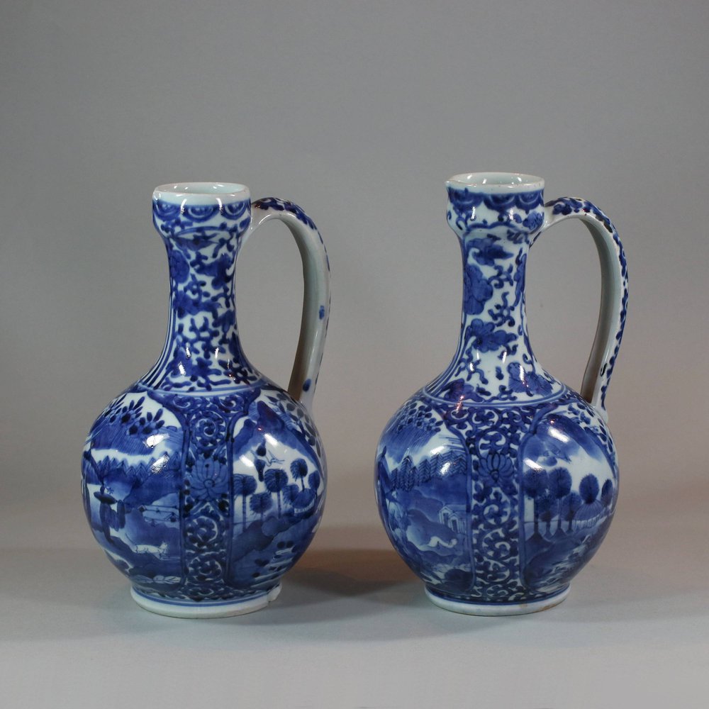 U905 Pair of Japanese Arita blue and white ewers, c 1680