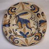 V487 Talavera plate, 17th century, decorated with a sprinting hare amongst stylised foliage,