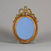 W134 Wedgwood blue jasper oval plaque sprigged in white with 'Aurora'