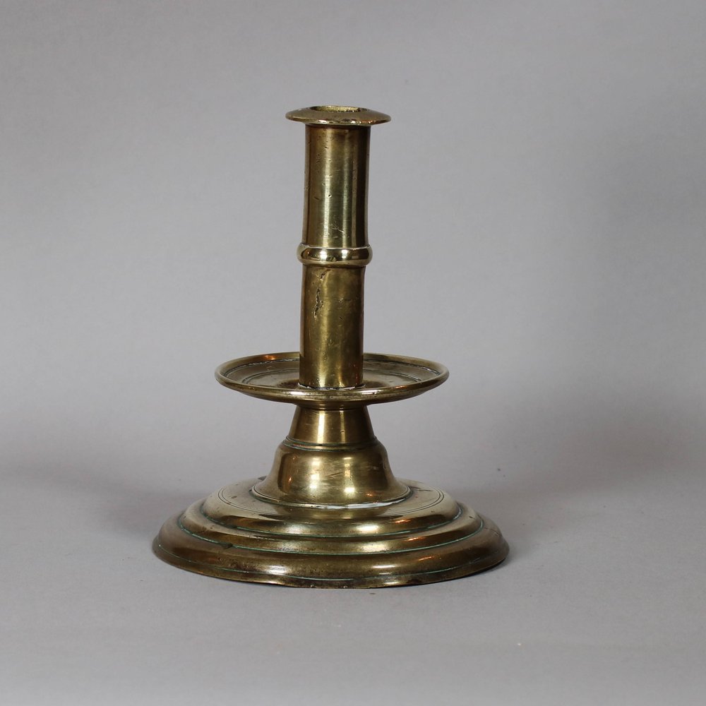 W469 Brass trumpet-form candlestick, 17th century