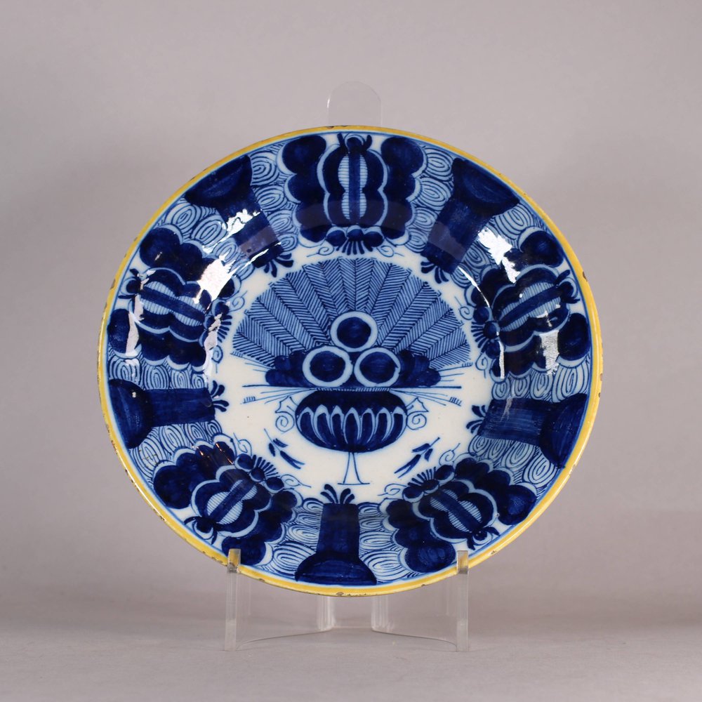 W499 Dutch delft blue and white 'Peacock' plate, 18th century, with underglaze blue mark on base B:P: with a J underneath, diameter: 23.2cm. (9 1/8in.), condition: some slight loss of glaze to ochre rim