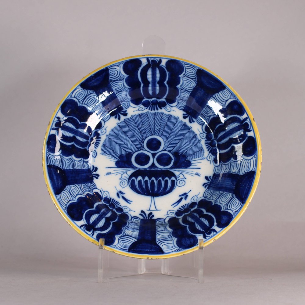 W499 Dutch delft blue and white 'Peacock' plate, 18th century, with underglaze blue mark on base B:P: with a J underneath, diameter: 23.2cm. (9 1/8in.), condition: some slight loss of glaze to ochre rim