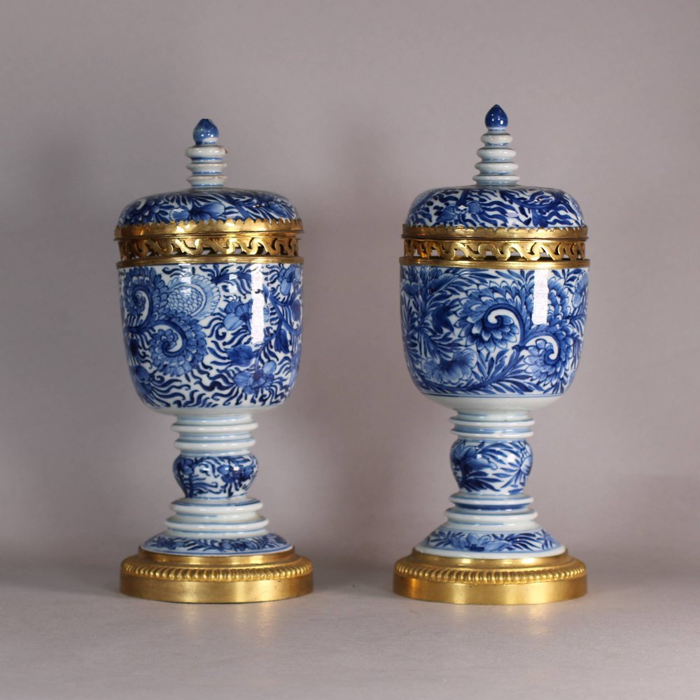 W544 Pair of ormolu mounted chalices with domed covers Kangxi(1662-1722) the cup shaped bowls supported on annulated stems with spreading feet, the covers with ribbed finals, all painted with in a bright u