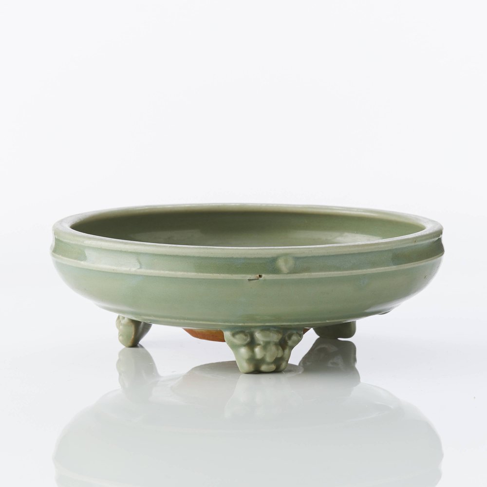 W552 A small ‘Longquan’ celadon tripod censer, Yuan or early Ming,