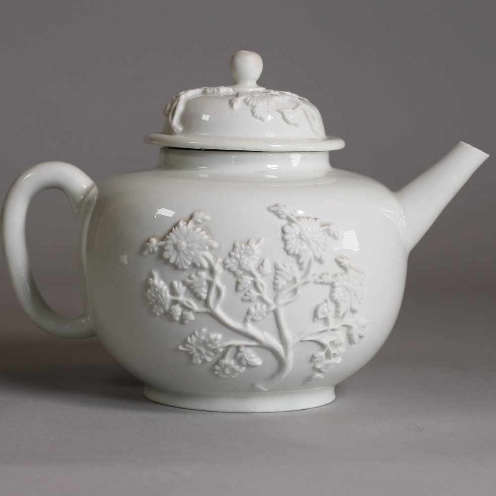 W703 Meissen Böttger white teapot and cover, circa 1715, with short conical spout and loop handle, the globular body decorated with ‘Irmingersche Belege’ applied