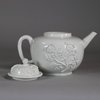 W703 Meissen Böttger white teapot and cover, circa 1715, with short conical spout and loop handle, the globular body decorated with ‘Irmingersche Belege’ applied