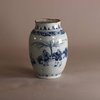 W718 An ovoid shaped Delft earthenware blue and white vase with a Chinoiserie decoration of figures in a landscape.