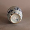 W718 An ovoid shaped Delft earthenware blue and white vase with a Chinoiserie decoration of figures in a landscape.