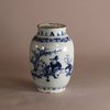 W718 An ovoid shaped Delft earthenware blue and white vase with a Chinoiserie decoration of figures in a landscape.