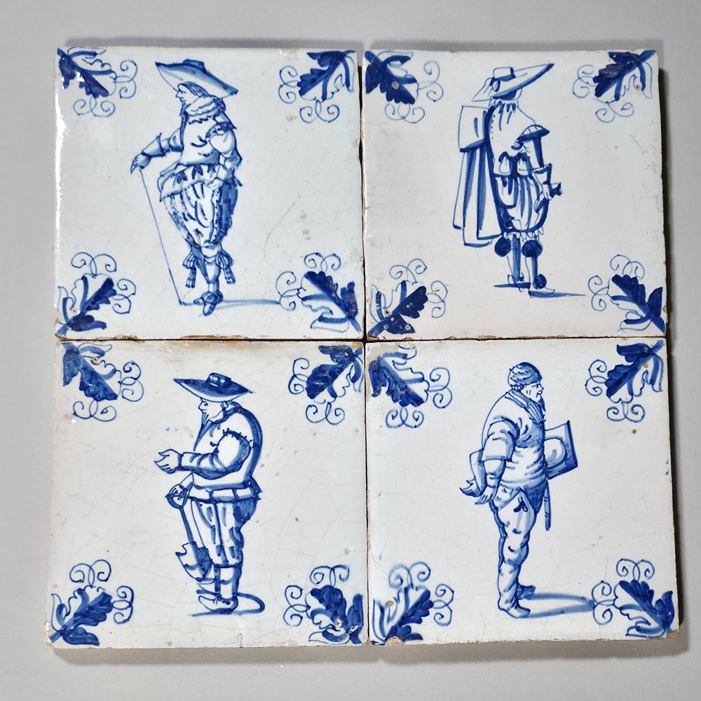 W947 Set of four Dutch tiles showing figures dressed in different costumes circa 1650