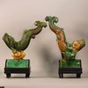 W990 Pair of MIng tile figures in the form of dynamic leaping carp in lead green and yellow glazed