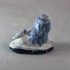 W993 Rare small Dutch delft blue and white figure of a recumbent lion