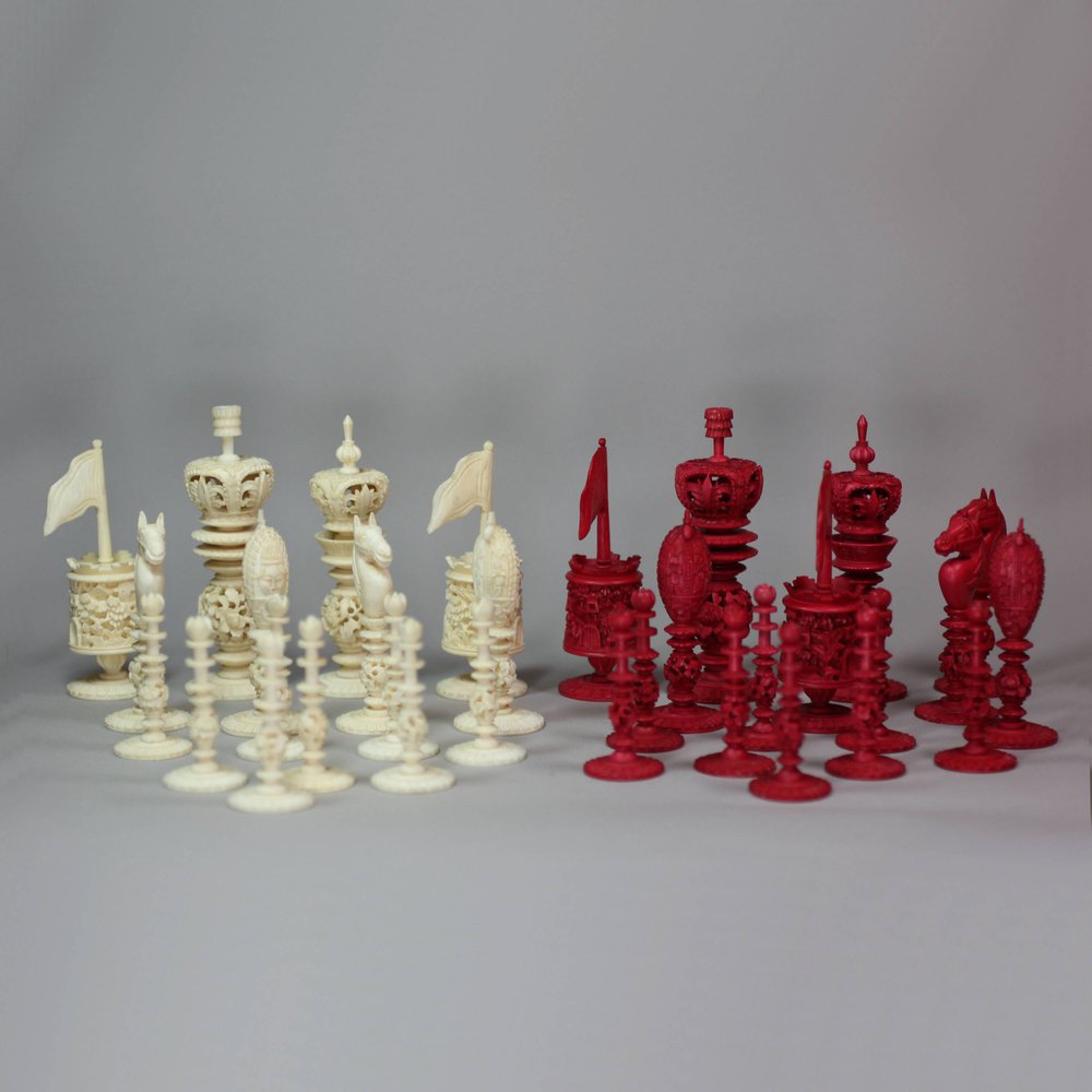 X170 'Burmese' pattern ivory chess set in red and white