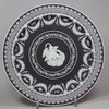 X537 A Wedgwood black jasper Trophy plate, 1820