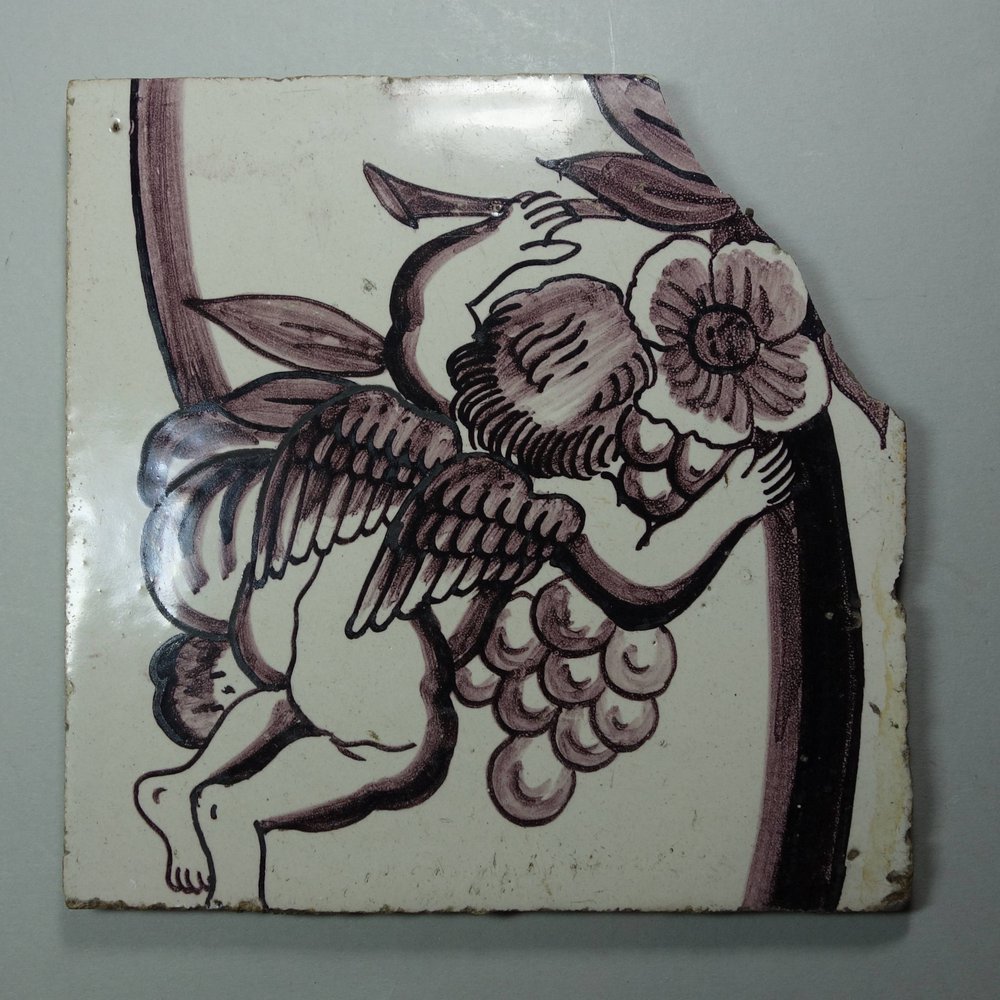 X608 Dutch delft manganese tile decorated with an angel