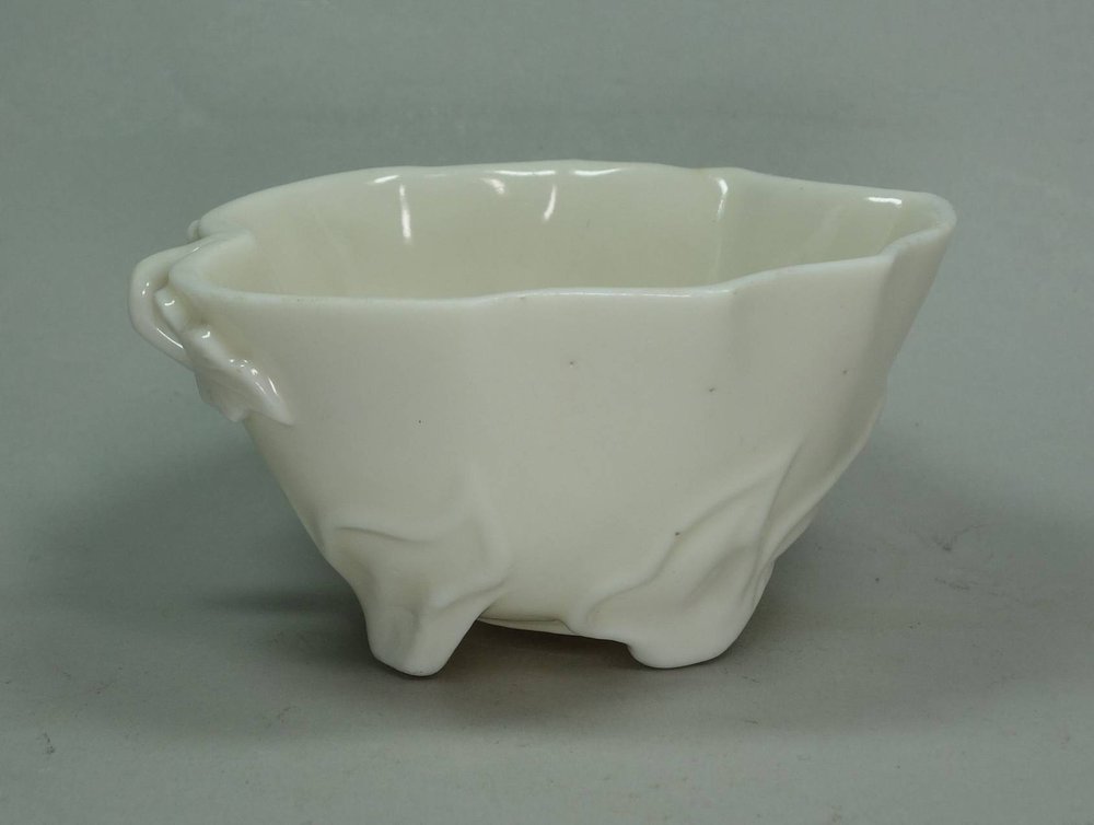 X675 Blanc de chine moulded cup in the form of lotus leaf