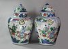 X859 Pair of Chinese wucai baluster vases and covers