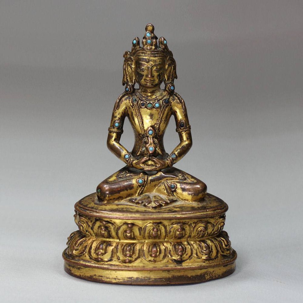 Y143 A Tibetan copper gilt figure of Amitayus, 15th century