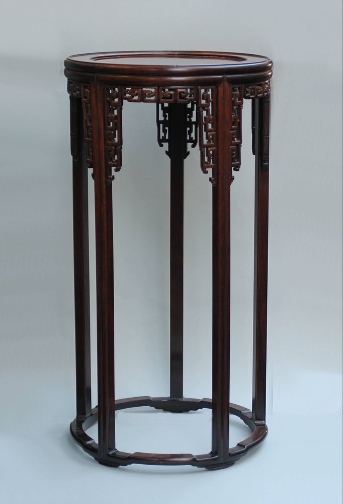 Y395 Hardwood circular carved stand, late Qing dynasty