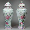 Y399 Pair of famille rose moulded vases and covers
