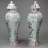 Y399 Pair of famille rose moulded vases and covers