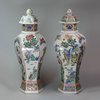 Y66 A matched pair of Chinese hexagonal baluster vases and covers