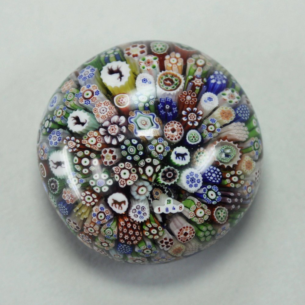 Y671 A Baccarat miniature close-packed millefiori glass paperweight