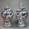 Y89 Pair of Japanese imari baluster vases and covers, circa 1700