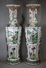 Y906 A pair of large famille verte lobed baluster vases and covers